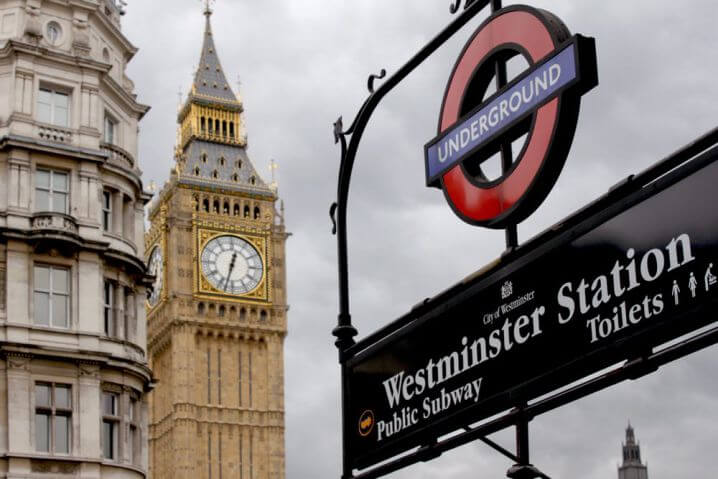 View of London's Big Ben with London Underground Westminster station sign infront