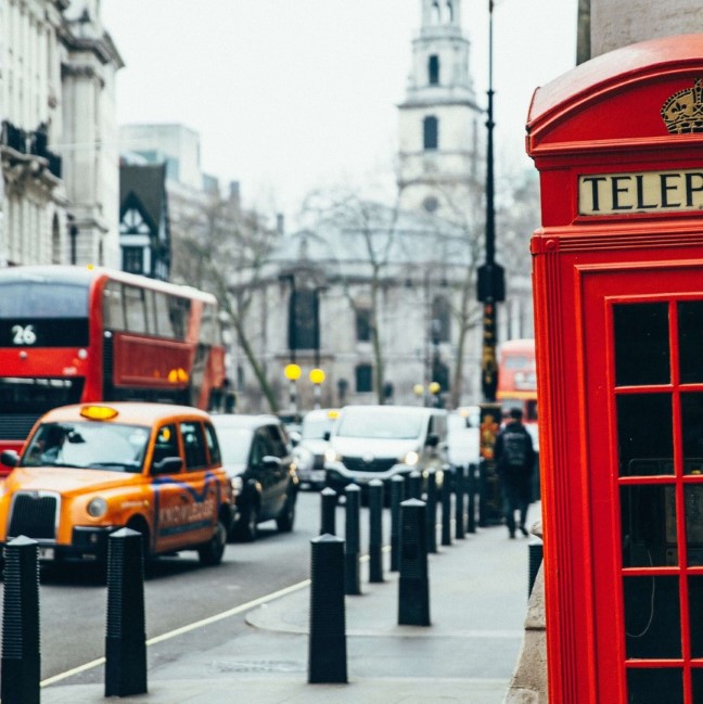 Photo of the famous London red phone box with a London bus and a London taxi in the background